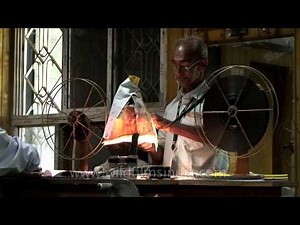 Spinning the spool to roll 35 mm film