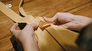 Italy accounts for 50% of all luxury goods production in the world. But are these goods produced in luxury conditions? Subcontractors of some big brands are now under investigation in Milan: | DW Euromaxx