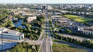 Aerial footage of the Highway 85 and Waterloo cityscape, on a sunny day in Ontario, Canada