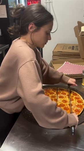 Pepperoni Pizza 📍USA 🇺🇸 Explore USA: tasteatlas.com/usa Although it sounds Italian, "Pepperoni" is a distinctly American invention. In Italy, the word peperoni (with one 'p') refers to bell peppers, so ordering a "pepperoni pizza" in Naples might result in a vegetarian meal. The sausage itself is an air-dried mix of pork and beef, seasoned with paprika and chili to achieve its signature bright red color. It was developed by Italian-American butchers in the early 20th century as a variation of