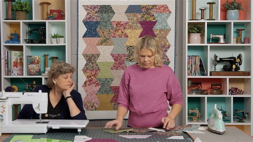 The Half Hexagon—like all good templates—is a multi-talented treasure. (We've used it to make braids, hexis, gems, and even Christmas trees. Peep our Half Hexi playlist on YouTube for dozens of project ideas.) This week, we’re adding a new hexi quilt to the list. It’s made with precut layer cake squares from Chelsea Garden by Moda Fabrics. And here's the best part: As you piece those easy half-hexi rows, an effortless zig zag border appears like magic! Watch the Honey Do tutorial now: https://bi