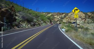 Driving Apache Trail Toward Apache Junction Various Gentle And Sharp Curves With Views Of Canyon Lake Arizona Passing 4 Vehicles And Two Motorcycles Coming From Opposite Direction