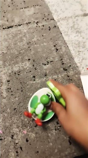 un boxing yoshi from super Mario Galaxy 2