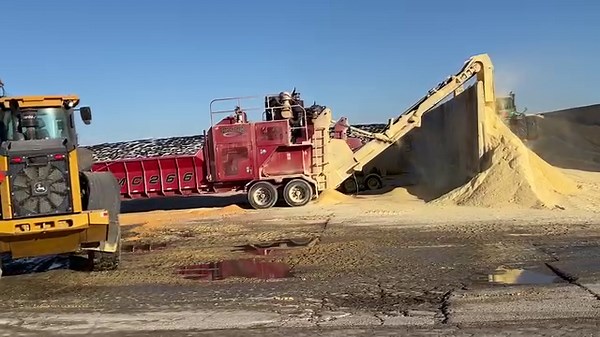Grinding high-moisture corn and bunker building in northeast Wisconsin. Always an impressive sight. | Milk Source, LLC