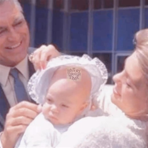 "Circa 1966, legendary actor Cary Grant and his fourth wife, actress Dyan Cannon, were photographed aboard the S.S. Oriana as they journeyed to England with their infant daughter, Jennifer Grant. The image beautifully captured Grant, then already a Hollywood icon from classics like North by Northwest (1959), embracing fatherhood with quiet pride. Cannon, radiant and youthful, complemented the family portrait, while baby Jennifer symbolized a new chapter of joy in their lives. The voyage aboard t