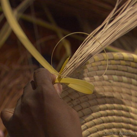 Mary Jackson weaves baskets using sweetgrass, pine needles, and sable palmetto. This artform originated from West Africa, where Jackson's ancestors were brought to the U.S. as slaves. Today she continues her family's basketry tradition, passing it onto her daughter and granddaughter. Watch the MEMORY episode now streaming at pbs.org/craftinamerica and craftinamerica.org. #craftinamericapbs #MEMORYepisode #MaryJackson #blackhistorymonth | Craft in America