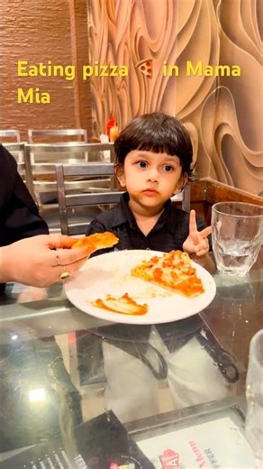 Eating pizza 🍕 in Mama Mia #shots #eating #pizza #trending #amir vlogs