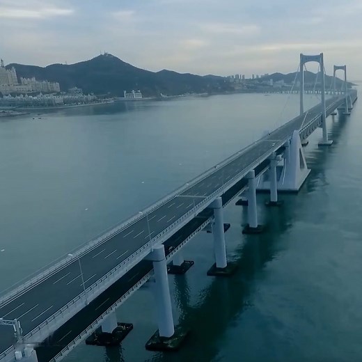 3.4K views · 192 reactions | Check out the scenery of Xinghai Bay Bridge, a major cross-sea suspension bridge in Dalian city, northeast China Liaoning Province. To build the bridge, about 14,700 kilometers (around 9,135 miles) of steel cable was used, which is more than the distance between Dalian and New York in the U.S. | China Plus Culture | Facebook