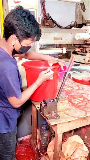 Real footage from inside the factory showing the complete process of making red plastic buckets.