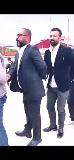 Coordinated Outdoor Dance Performance by Men in Suits