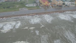 RAW VIDEO: Take a ride with the U.S. Coast Guard above Galveston, Texas, as high winds and waves from Tropical Storm Bill batter the coast. Look at all that wave action! | The Weather Channel