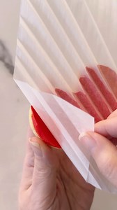 Got parchment paper? This technique might just change the way you decorate cookies! This awesome technique involves placing a piece of parchment paper when your icing is wet. And yes, you need to let the icing dry before attempting to remove the parchment. Here I used 15 second consistency icing. Would you try this technique or have already? #royalicing #cookiedecorating #decoratedcookies #sugarcookies #cookietechnique | The Cookie Box Club