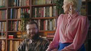 Persistent lady boss flirting with nerdy IT employee at work, office romance