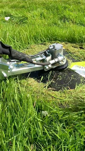 The barrier mower eliminates manual cutting under fences, and removes the risk of damaging posts with a flail mower. The automatic spring arm follows the fence and moves away on impact, protecting both machine and fence. | GreenTec