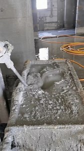 Clever way to mix cement slurry in a wheelbarrow