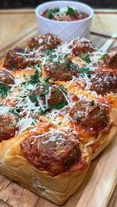 Cheesy, saucy party-perfect sliders Meatball Sliders Ingredients • 1 pack King’s Hawaiian rolls (12-count) • 12 meatballs (homemade or frozen) • 24 oz Carbone pasta sauce • 1–1½ cups shredded mozzarella • Parmesan (measure with your heart) • Parsley, chopped Directions 1. Keep rolls attached; hollow each top with a paring knife. 2. Warm meatballs in Carbone sauce. 3. Add 2 tsp mozzarella into each hollow. 4. Add one meatball to each roll. 5. Top with Parmesan parsley. 6. Bake at 350°F for 10 min