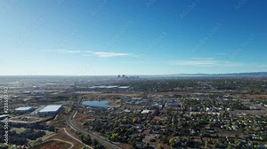 Drone aerial view flying to the left of downtown Denver skyline