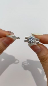 129K views · 293 reactions |  Love in full bloom. This bridal set—featuring a floral halo embracing a round-cut center stone—pairs effortlessly with a delicate semi-eternity band. Timeless, just like your love. https://shesaidyes.design/91fji | Shesaidyes Jewelry | Facebook