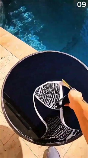 Cleaning circular glass surface with steady squeegee strokes