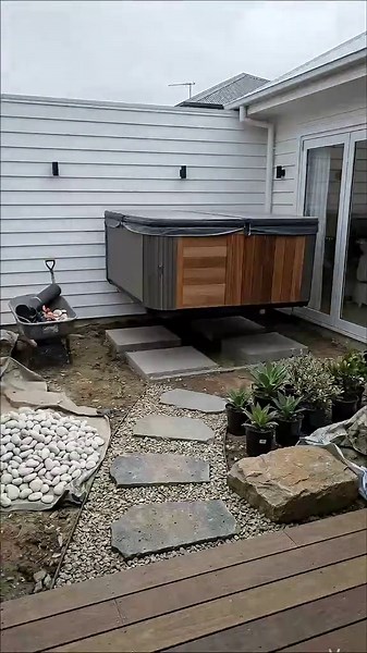 Backyard Jacuzzi Spa Transformation ♨️ This relaxing backyard spa transformation turns a simple patio into a luxury hot tub garden retreat. Watch the space evolve with: \t•\tpebble landscaping \t•\tstepping stone path \t•\twarm lantern lighting \t•\tmodern outdoor jacuzzi spa Perfect for anyone dreaming of a luxury backyard relaxation space. #f