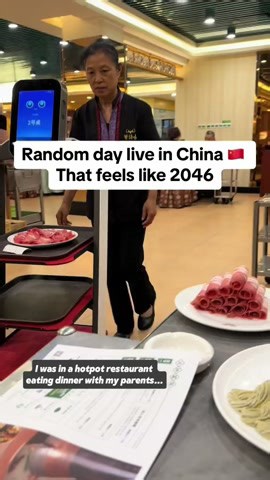 Robot waiter surprises us at a traditional Beijing hotpot