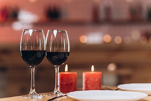 Table setting for romantic dinner in restaurant for two person. Wine...
