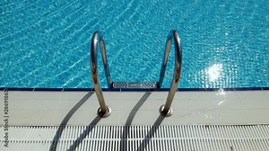Grab bars ladder in the swimming pool