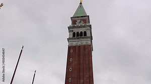 Tilt down of St. Mark’s Campanile, majestic bell tower at Saint Mark's Square, Venice