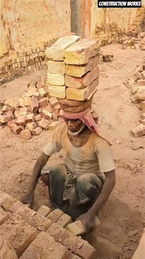 👷‍♂️🧱 Manual Brick Stacking: Laborer Loading Heavy Kiln Bricks