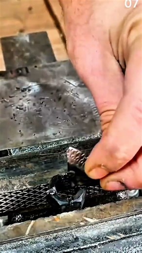 Inserting textured metal strip into braided wire clamp setup