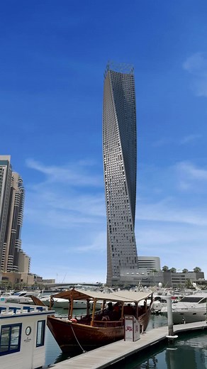 Watch the Mind-Blowing Giant Straightener Straighten Dubai's Curved Building!
