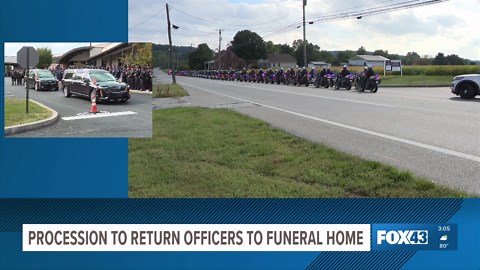 Law enforcement leads procession to return fallen officers to funeral home