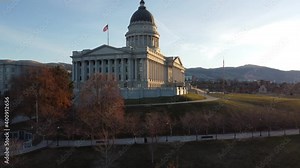 Utah State Capitol Building in Salt Lake City at dawn with lens flare (Aerial 4K Drone Video)