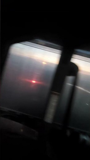 Grain buggy filling up tractor trailer with corn