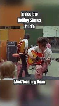 Mick Jagger Teaching Brian Jones how to play Sympathy For The Devil