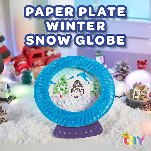 Shake it up! Create a DIY snow globe at home with our fun and easy paper plate craft for kids. ❄️ 🐧 | Crayola