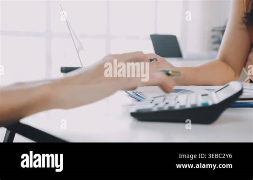 young woman sitting on the table and working with laptop Stock Video Footage - Alamy