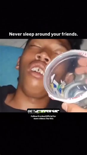 PrankedOfficial on Instagram: "A close-up video of a young man sleeping soundly on the floor with his mouth open. A person holds a plastic cup filled with small, noisy objects (like beads or tiny toy pieces) right above his mouth. They quickly tip the cup, pouring the contents onto the sleeper’s face. The loud, sudden noise right by his ear and the feeling of objects hitting him cause him to wake up instantly and jump in a loud, shocked reaction. #SleepingPrank #LoudPrank #ScaredFriends #FunnyPr