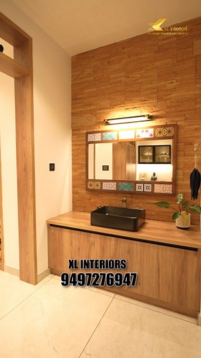 Antique charm with dado stone cladding and warm wooden accents in a common wash area.✨ Transform your space into a beautiful modern home with XL Interiors. | XL interiors