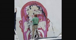 Mural of George Floyd defaced with black tar, investigated as hate crime