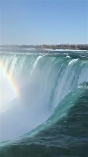 Spring at Niagara Falls, mist rising, a rainbow dancing above the roaring water, pure magic!