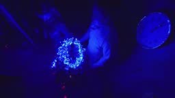 The family fast and fanny decorates the Christmas tree. Top view....