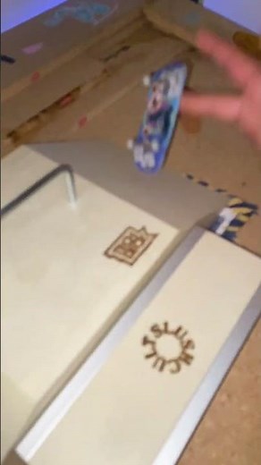 Finger boarding on tech deck ramp