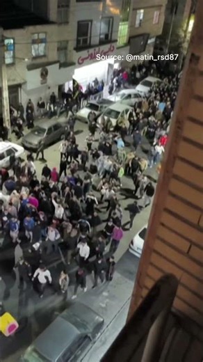 Demonstrators march in Iran's Malard city