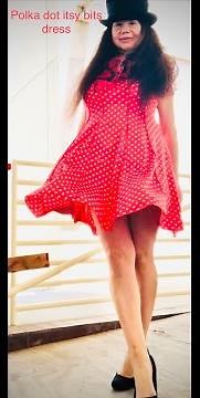 Windy day with polka dot itsy bitsy orange dress