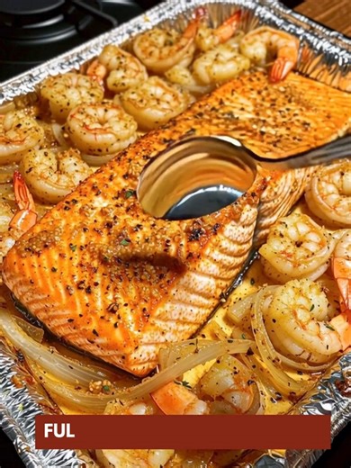Oven-Baked Cajun Salmon & Shrimp Tray 🔥🐟 Bold flavors for the ultimate easy sheet pan dinner! 📝 Ingredients : 1 large salmon fillet (center-cut, skin-on for crispy finish) 1 lb large shrimp, peeled and deveined (juicy seafood boost) 1 large onion, sliced (sweet roasted flavor) 2 tbsp olive oil (sheet pan essential) 2 tbsp melted butter (rich garlic butter vibe) 3 cloves garlic, minced (bold Cajun flavor bomb) 1 ½ tbsp Cajun seasoning (spicy comfort kick) 1/2 tsp smoked paprika (deep smoky tou