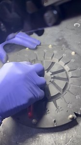 When we say, "made by many hands"--we really mean it! Here, Lois is making a fresh mold for our Maple Leaf Mini Post earrings. The rubber mold has been vulcanized with the models in it, and here she is cutting the vents so that the gas can escape when the pewter is later poured in. #americancraft #behindthescenes #danforthpewter | Danforth Pewter