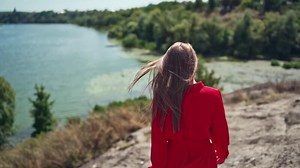 Woman relaxing in mountains. Carefree happy woman enjoying nature