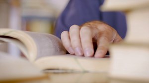 Close Up Of Man's Hand Scanning Book Reads Stock Footage SBV-308726577 - Storyblocks