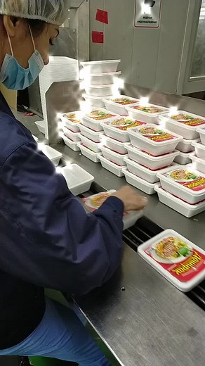 Food Packaging Process in Industrial Kitchen